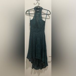 A high-low gorgeous dark green lace dress with sequins for the perfect look!